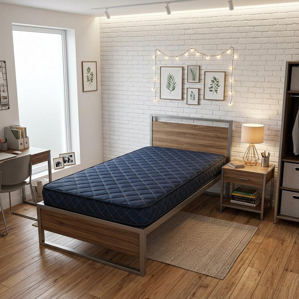 6" Navy Blue Twin Memory Foam Water Resistant Mattress styled in a furnished interior with a cream wall on a dark wood floor.