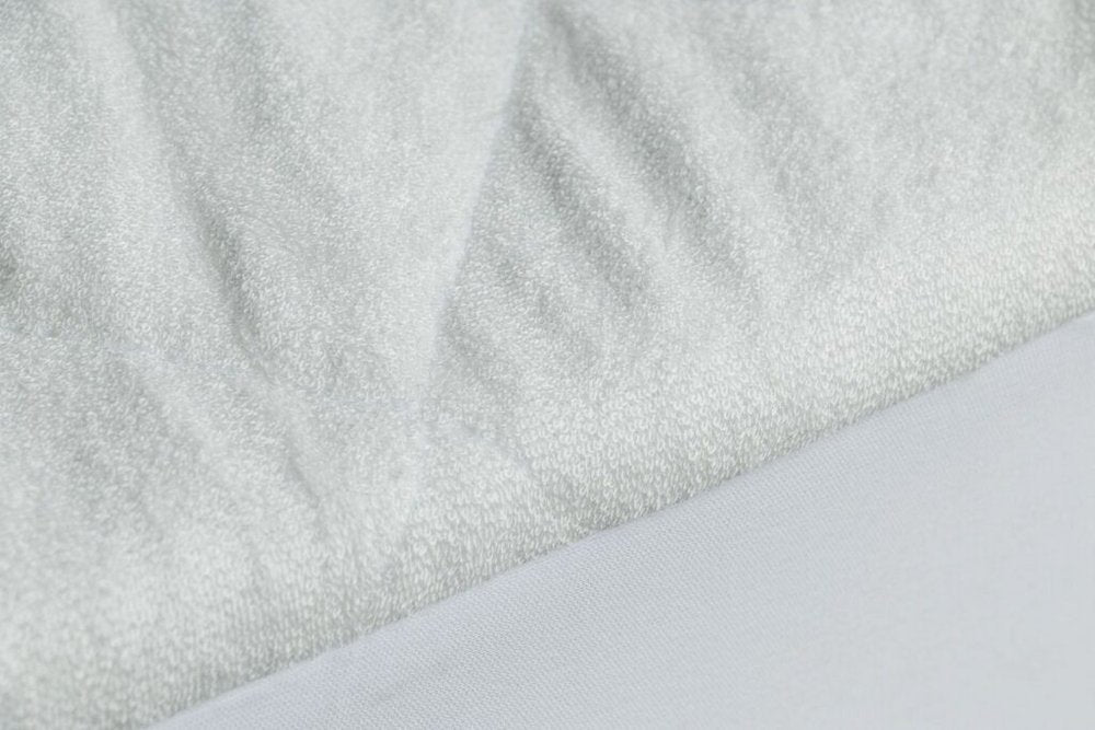 9" Deep Waterproof Bamboo Terry Cloth Crib Mattress Cover on a white background