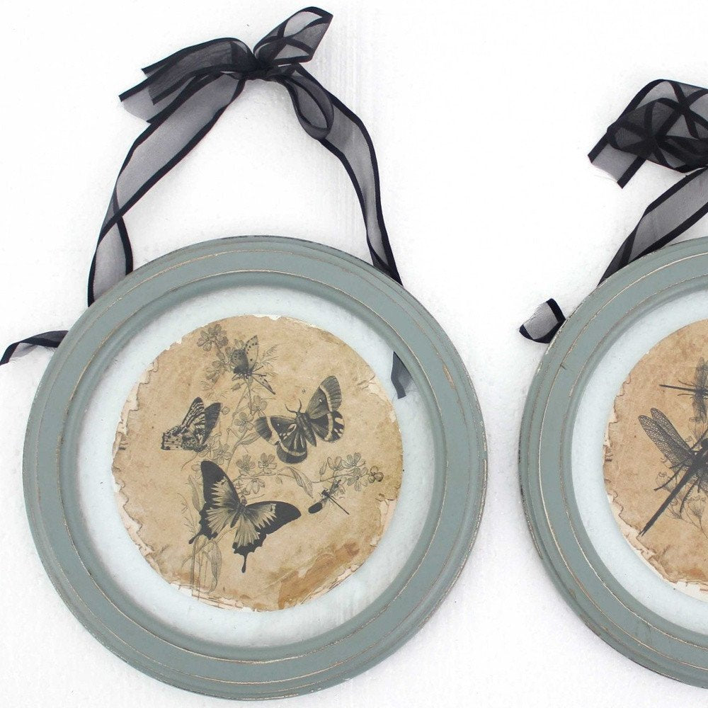 Set of Two Green And Ivory Butterfly Glass Circle on a white background
