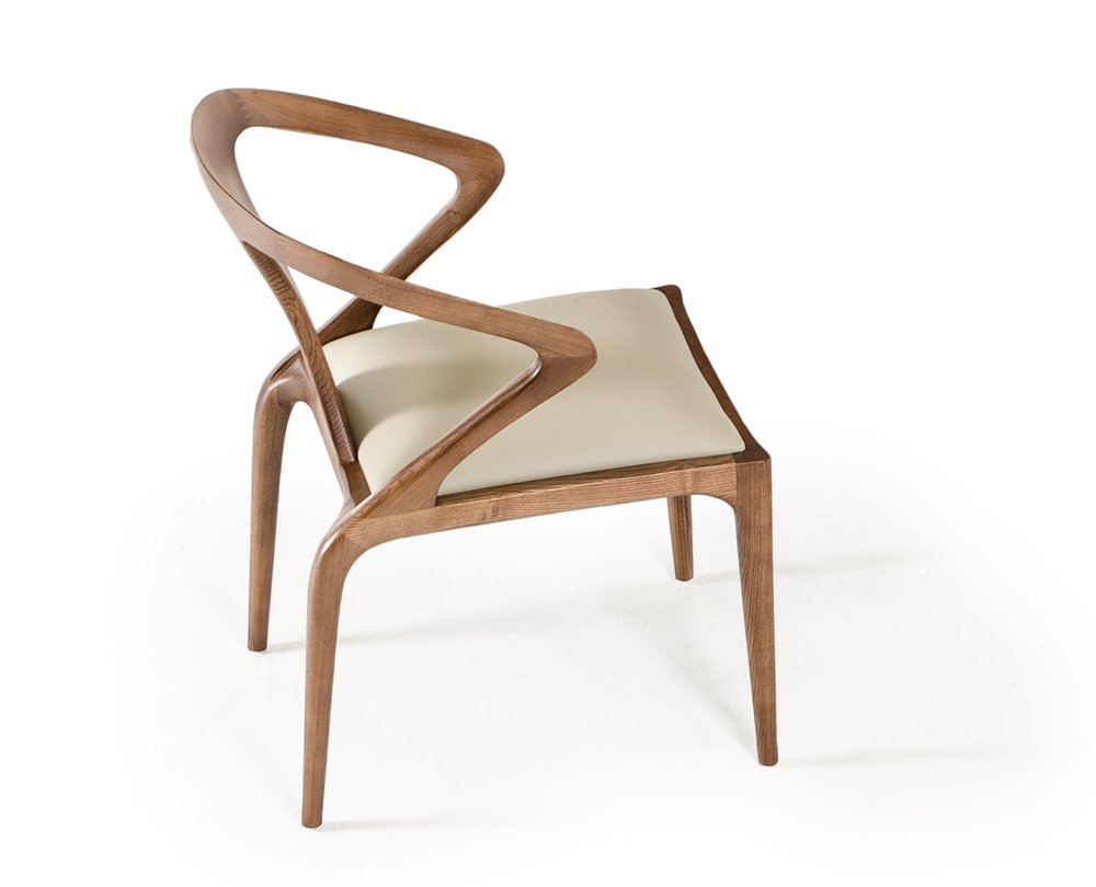 A modern wooden dining chair with a curved back and light-colored upholstered seat on a white background.
