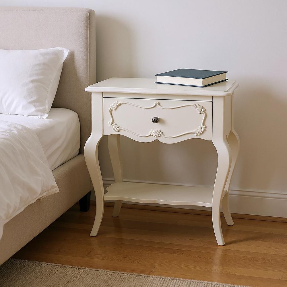 26" Solid Wood And Mirrored Glass Nightstand styled in a furnished interior with a light gray wall on a dark wood floor in dark brown wood.