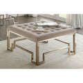 36" Champagne Polyester Tufted Cocktail Ottoman. Ottoman isolated on a plain white background, finished in tan fabric.