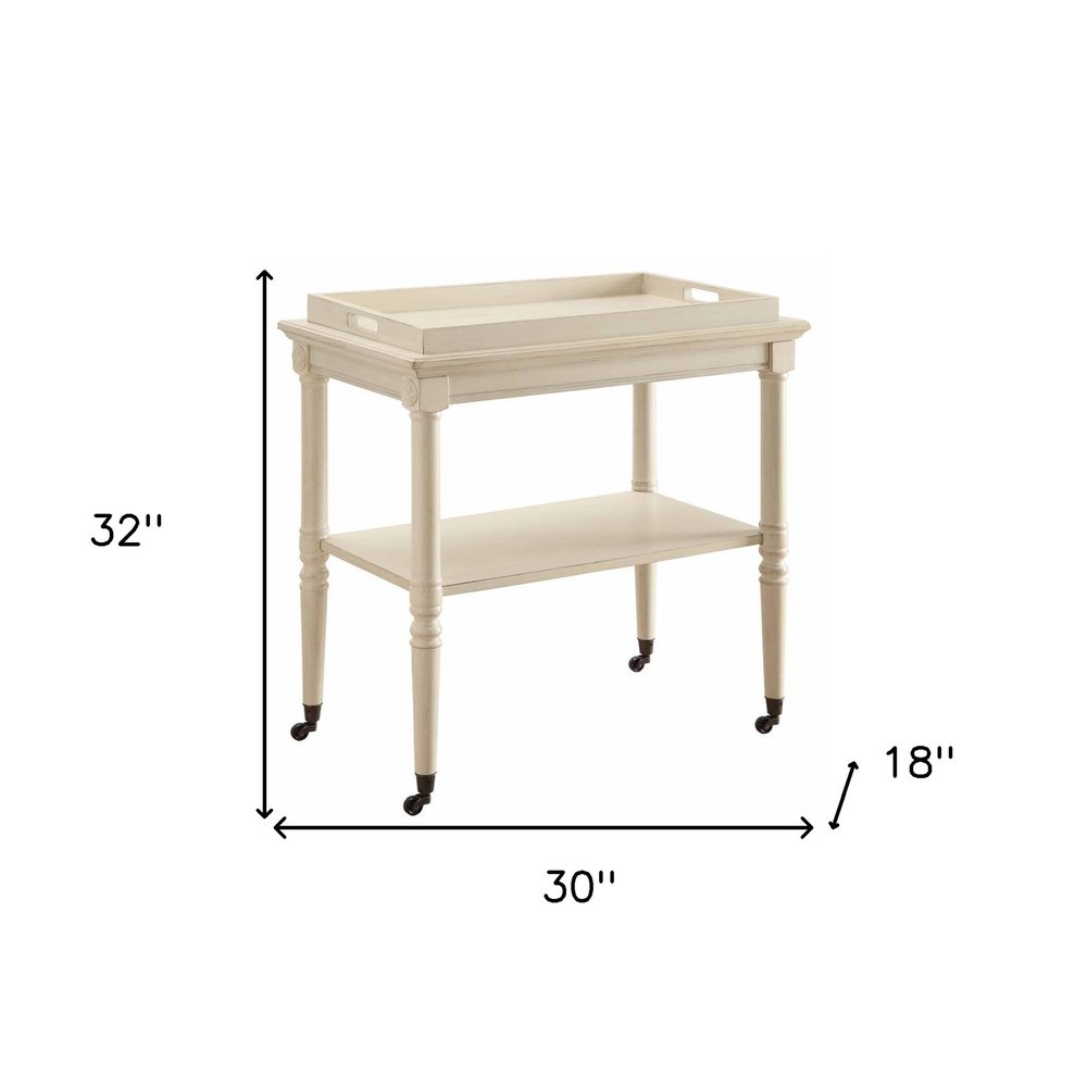 30" Antiqued White Wood Rolling Bar Cart. Bar cart isolated on a plain white background, showing a white wood surface.
