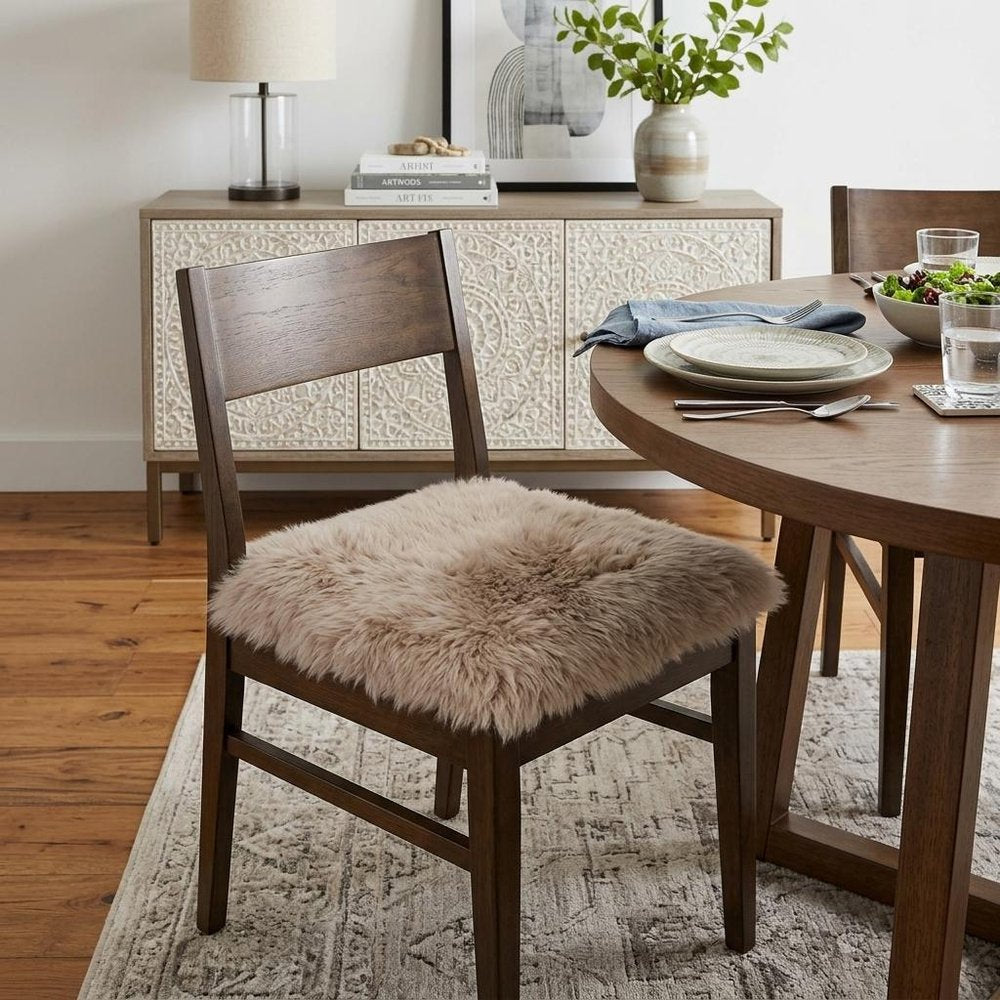17" X 17" White Synthetic Solid Color Pad styled in a furnished interior with a light gray wall on a dark wood floor.
