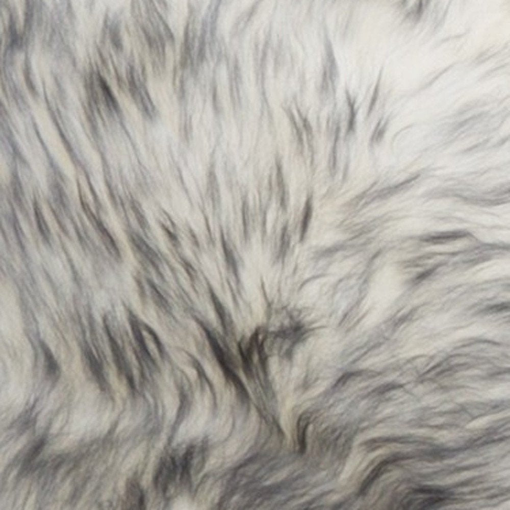 Detail view of 17" X 17" Gray Genuine Sheepskin Chair Pad, filling the frame with the gray texture.