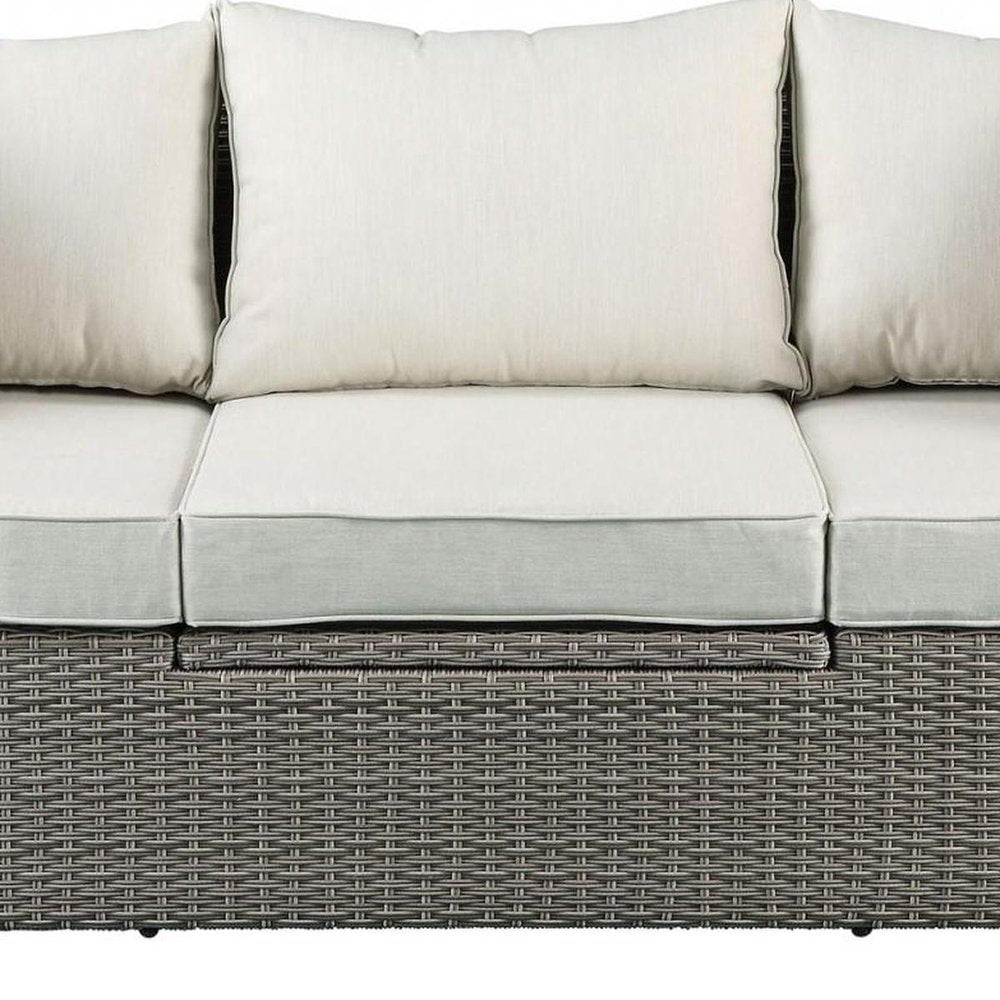 Three Piece Outdoor Gray Wicker Sectional Seating Group with Beige Cushions close-up detail