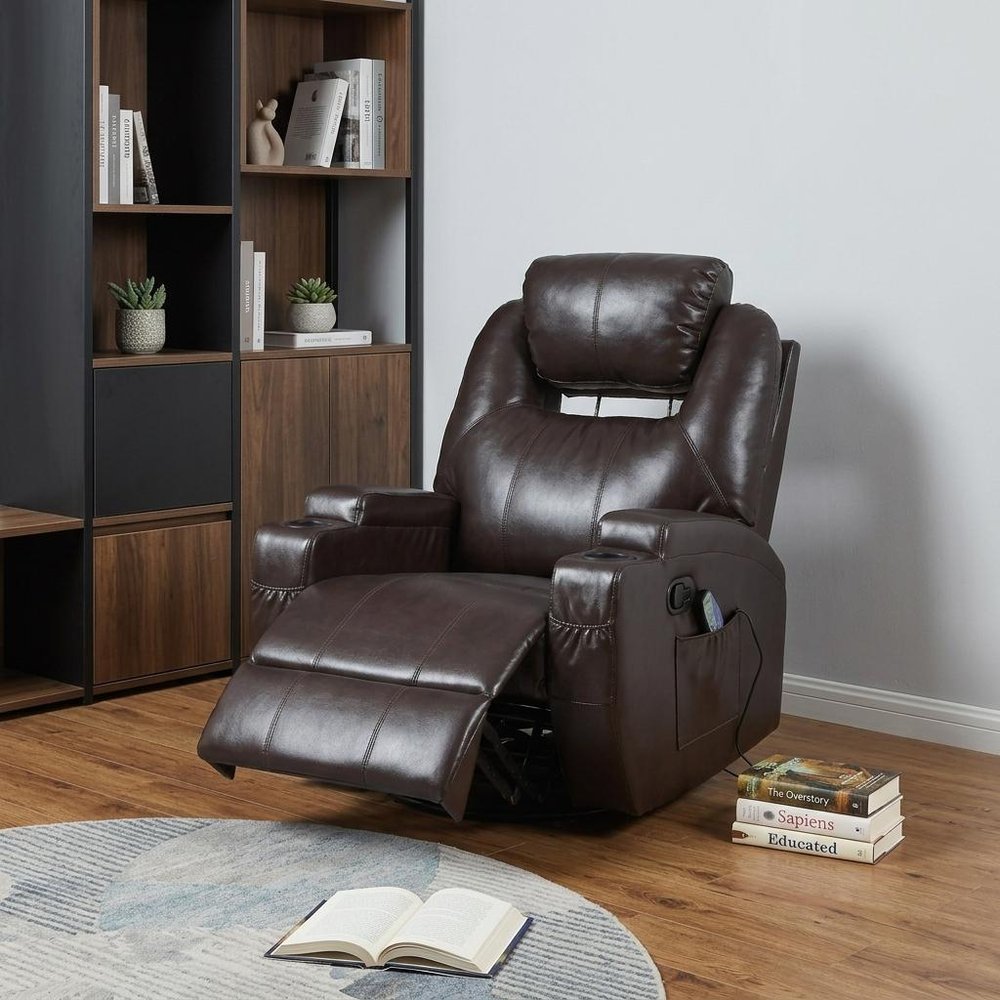 34" Brown Faux Leather Heated Massage Home Theater Recliner styled in a furnished interior with an off-white wall on a tiled floor.