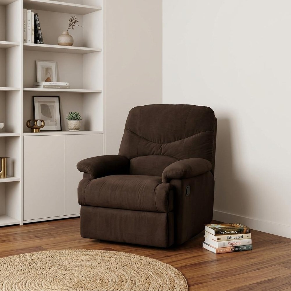 35" Chocolate Microfiber Recliner styled in a furnished interior with an off-white wall on a wood floor in tan.