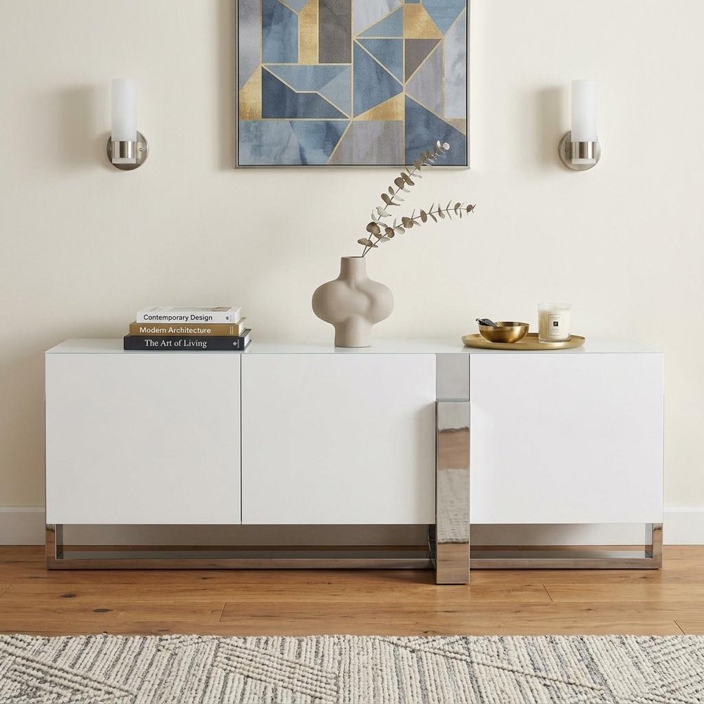 91" White Glass and Stainless Steel Frame Console Table in a home interior