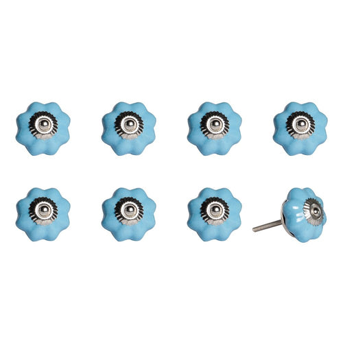 Eight glossy light blue ceramic flower-shaped cabinet knobs with silver centers on a white background.