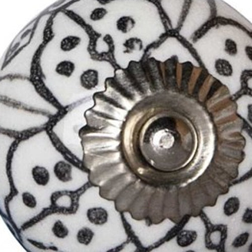 1.5" X 1.5" X 1.5" Black Gray And Silver Knobs 12 Pack. Close-up of a white ceramic knob with a black floral mandala pattern and a scalloped silver center plate.