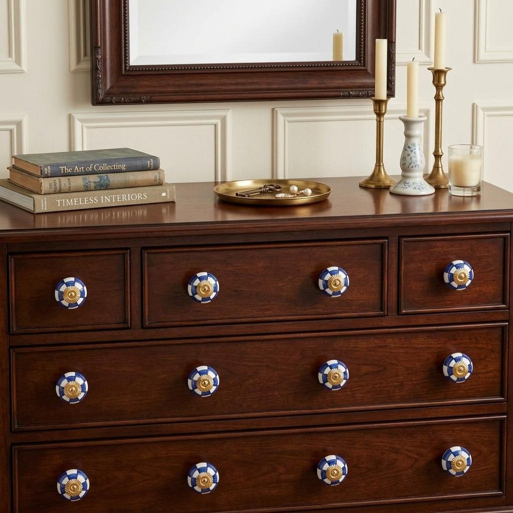 Set of Twelve Blue White And Gold Geometric Ceramic Drawer Pull Knobs in a home interior