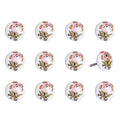 Set of Twelve Pink And White Floral Ceramic Drawer Pull Knobs on a white background
