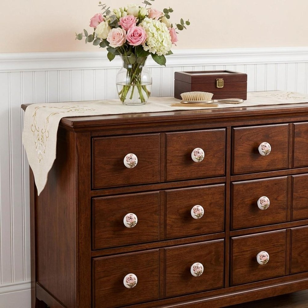 Set of Twelve Pink And White Floral Ceramic Drawer Pull Knobs in a home interior
