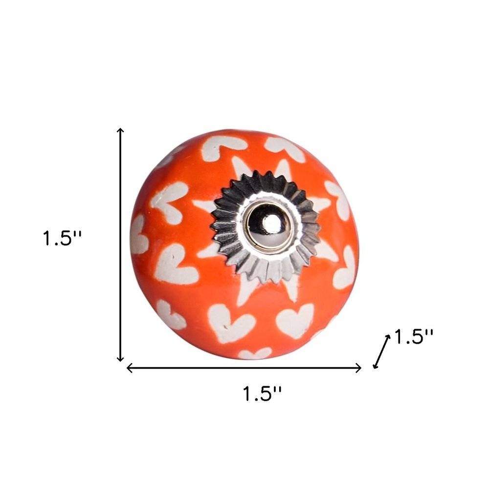 Set of Twelve Orange White And Silver Floral Ceramic Drawer Pull Knobs on a white background