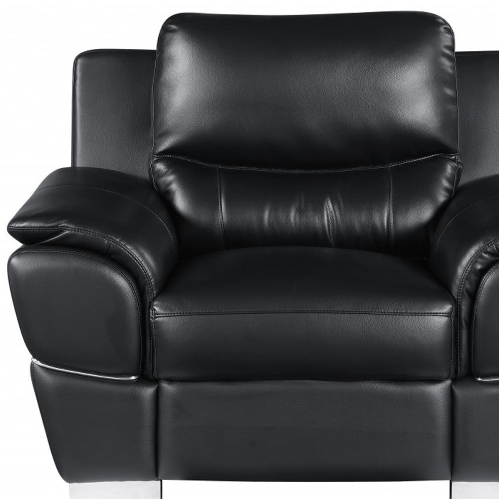 Close-up of 48" Black And Silver Leather Match Club Chair showing silver leather detail.