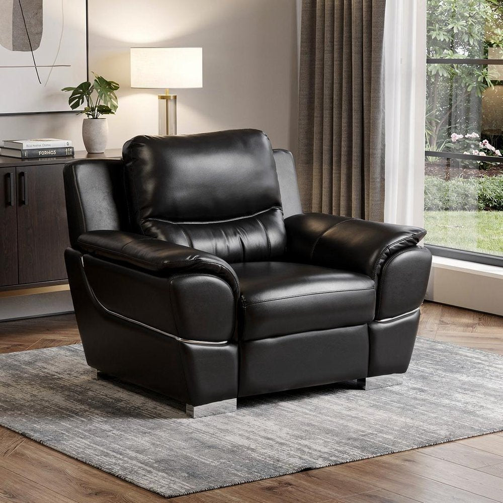 48" Black And Silver Leather Match Club Chair styled in a furnished interior on a tiled floor against an off-white wall.