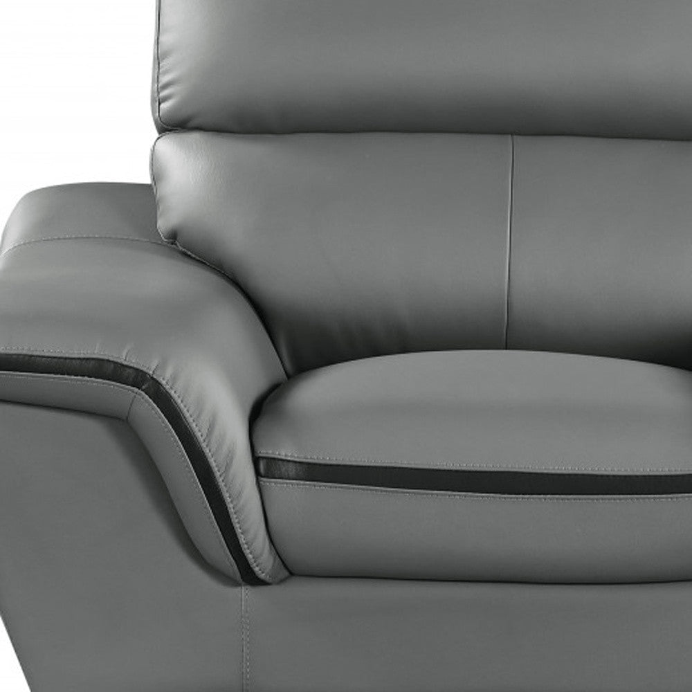 Detail view of 49" Gray And Silver Leather Match Convertible Chair, filling the frame with the silver leather texture.