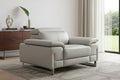 51" Gray And Silver Genuine Leather Chair and a Half styled in a furnished interior on a tiled floor against an off-white wall.