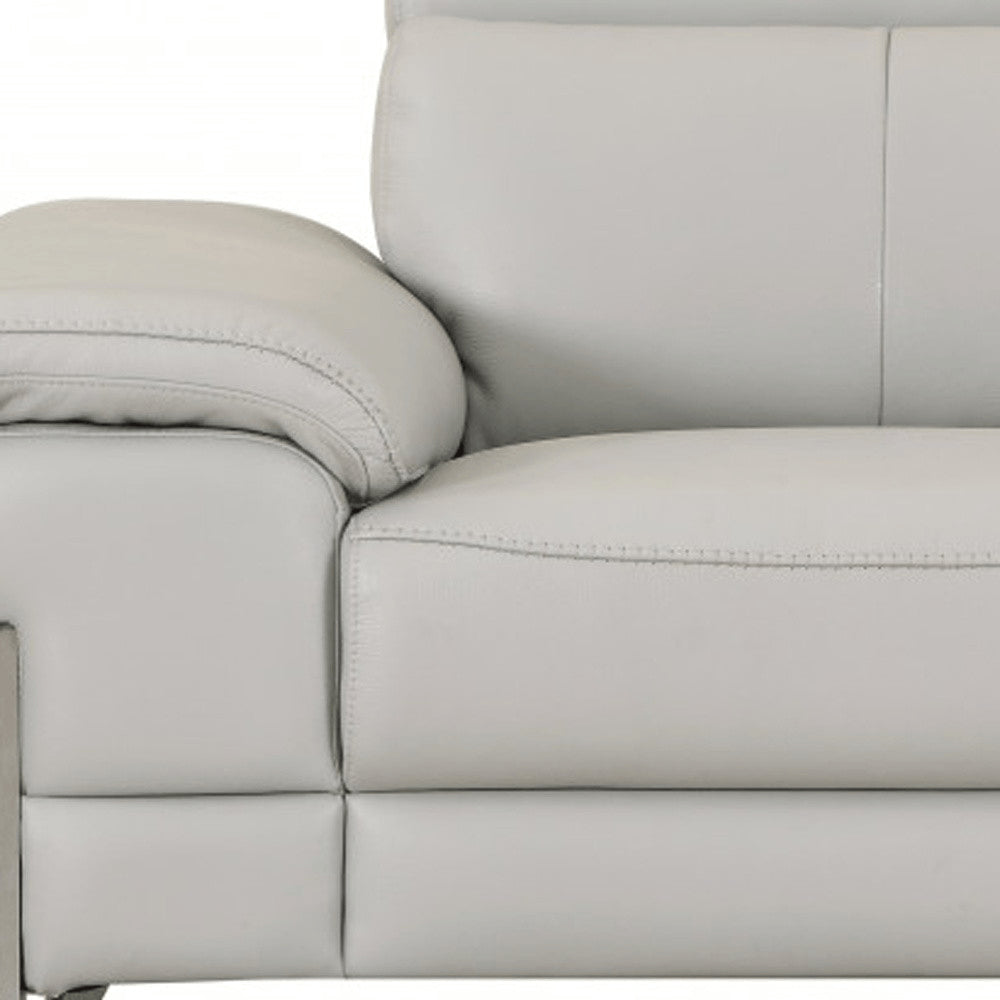 Detail view of 51" Gray And Silver Genuine Leather Chair and a Half, filling the frame with the silver leather texture.