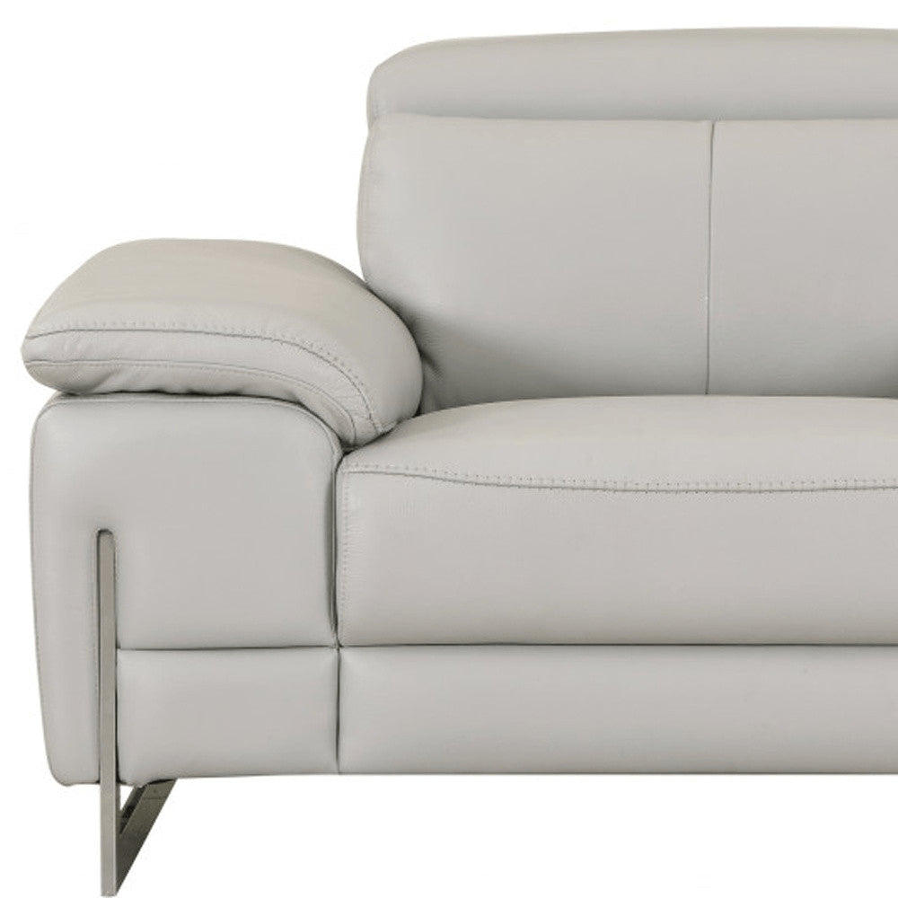 51" Gray And Silver Genuine Leather Chair and a Half. Accent chair isolated on a plain white background, in a silver leather finish.