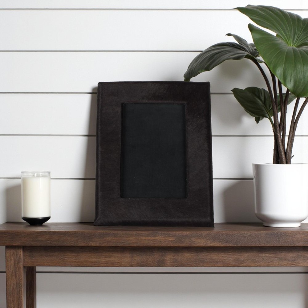 4" x 6" Black Cowhide Picture Frame with Mat. Picture frame in black.