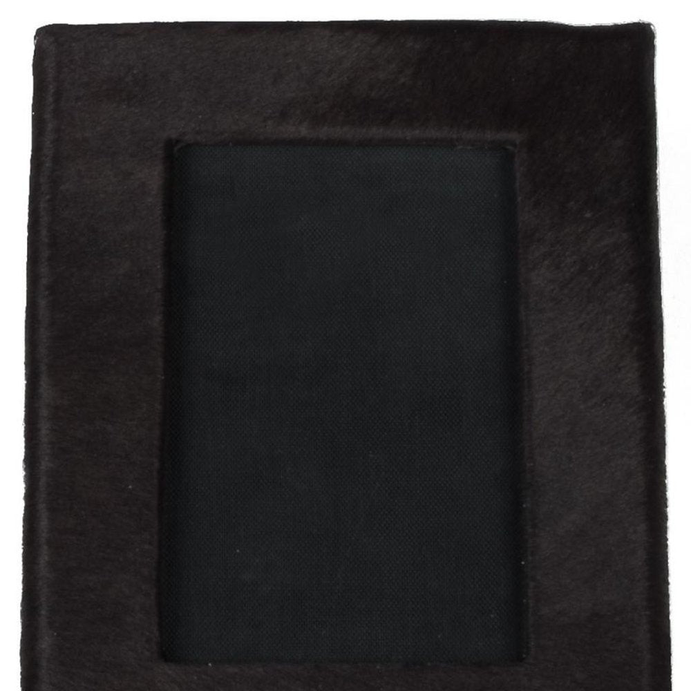 Detail view of 4" x 6" Black Cowhide Picture Frame with Mat, filling the frame with the black texture.