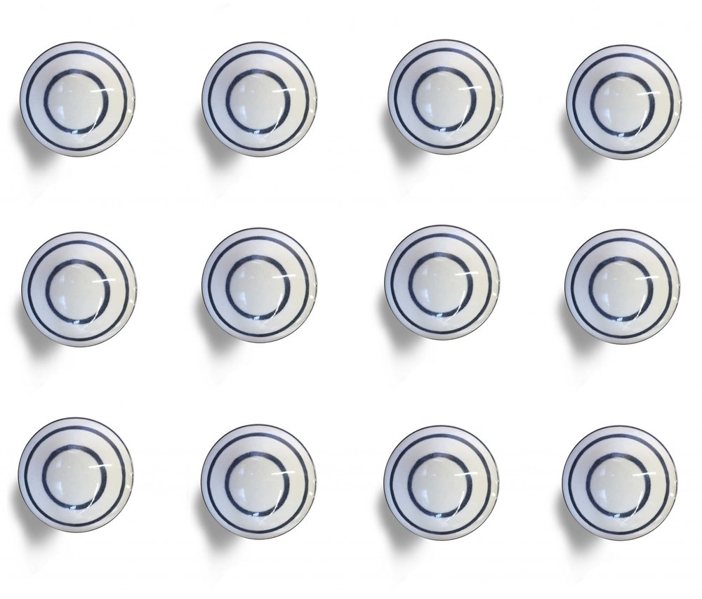 Set of Twelve White and Black Ceramic Drawer Pull Knobs on a white background