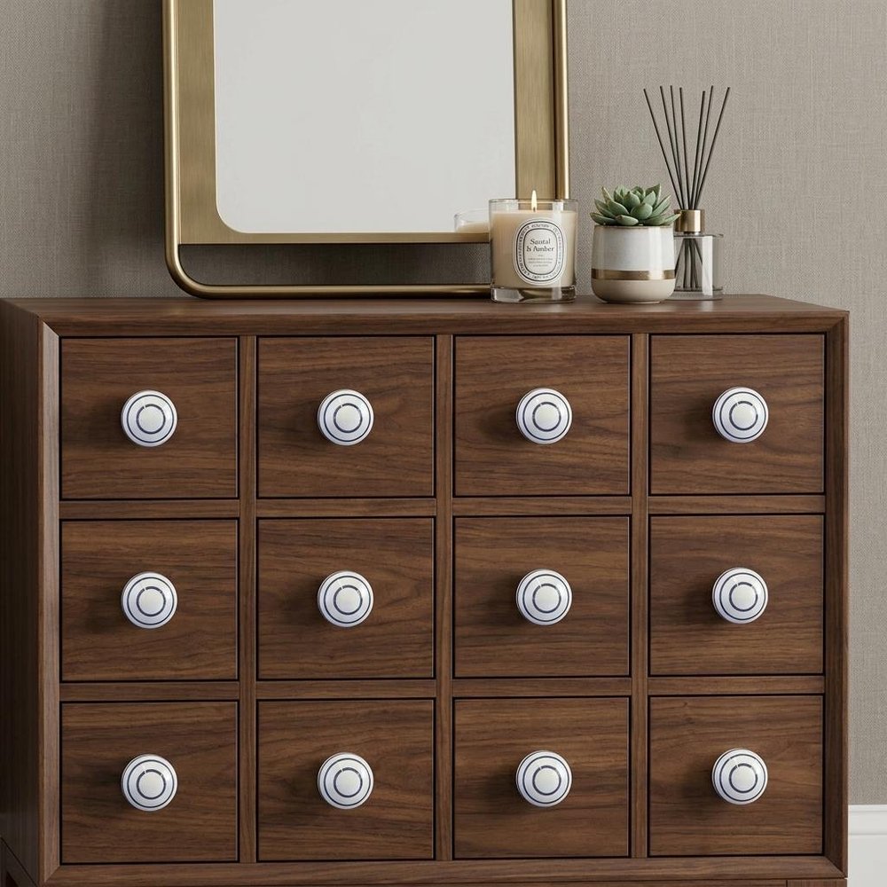 Set of Twelve White and Black Ceramic Drawer Pull Knobs in a home interior
