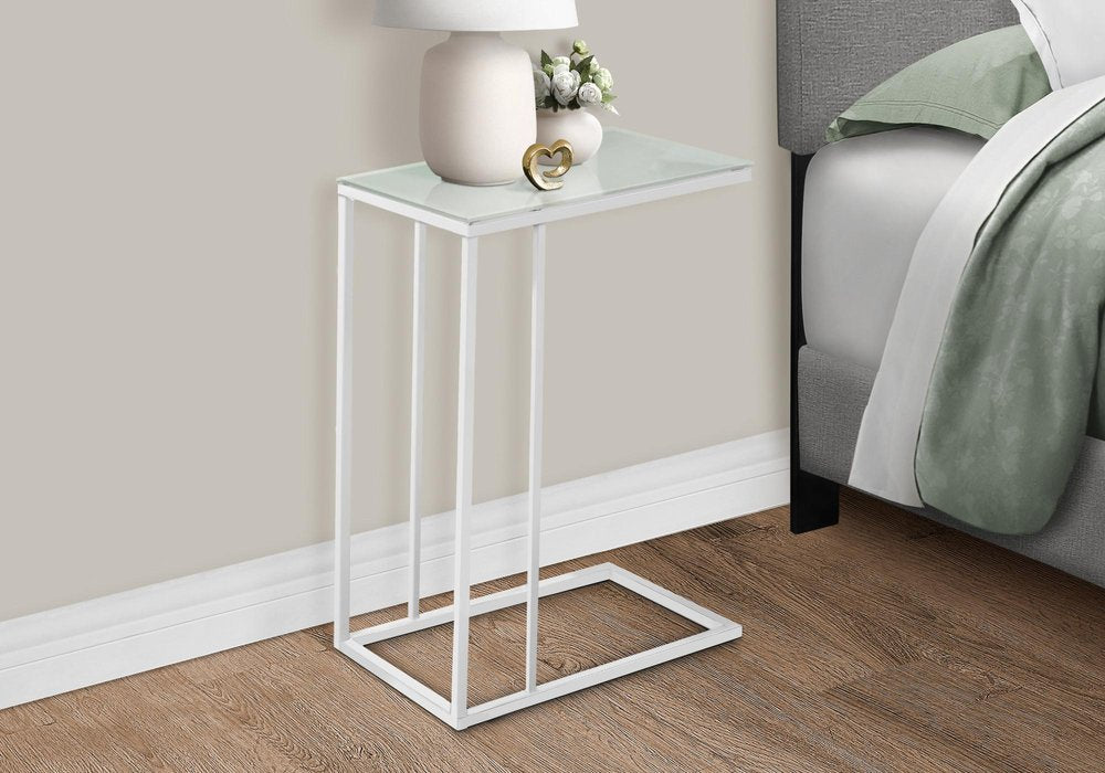 18.25" X 10.25" X 24" White Metal Tempered Glass Accent Table styled in a furnished interior with a light gray wall on a wood floor.