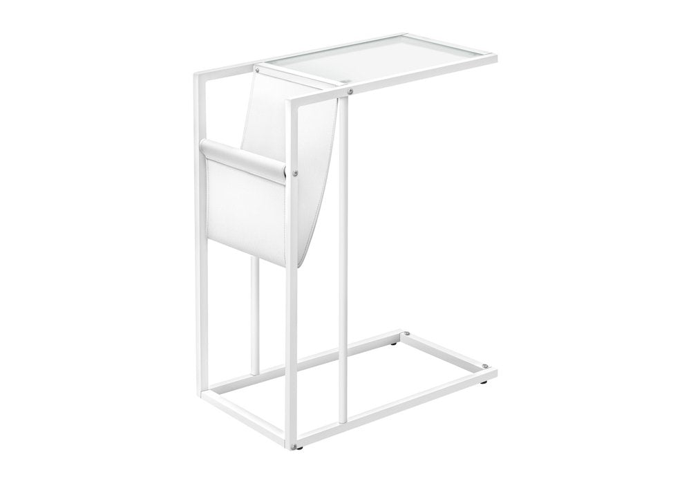 White modern metal side table with a white fabric magazine holder and a glass top, on a white background.