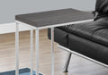 18.25" X 10.25" X 25.25" Grey Particle Board Metal Accent Table styled in a furnished interior with a light gray wall on a tiled floor in gray metal.