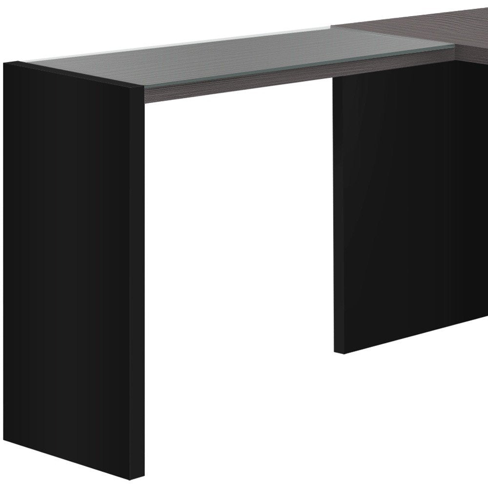 60" Gray and Black L Shape Computer Desk With Three Drawers. Desk isolated on a plain white background, in a black finish.
