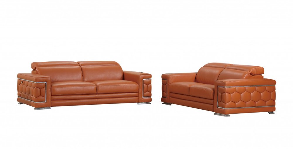 Two camel Italian leather sofas with hexagonal patterned arms and chrome accents on a white background.