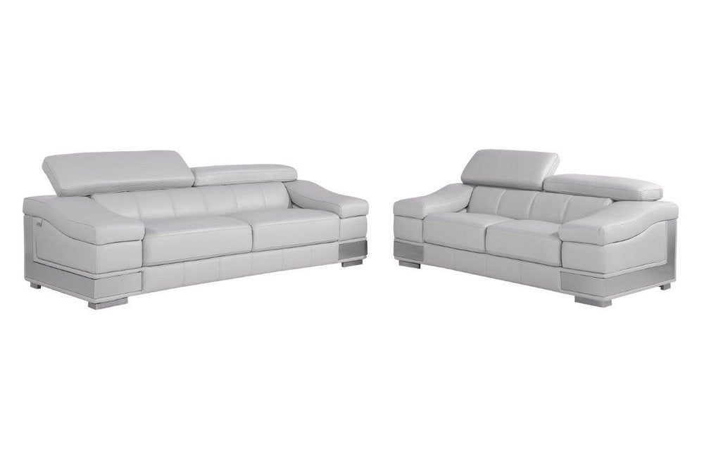 Two light gray Italian leather sofas with adjustable headrests on a white background.