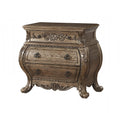A brown solid wood nightstand with three drawers and ornate carvings sits on a white background.