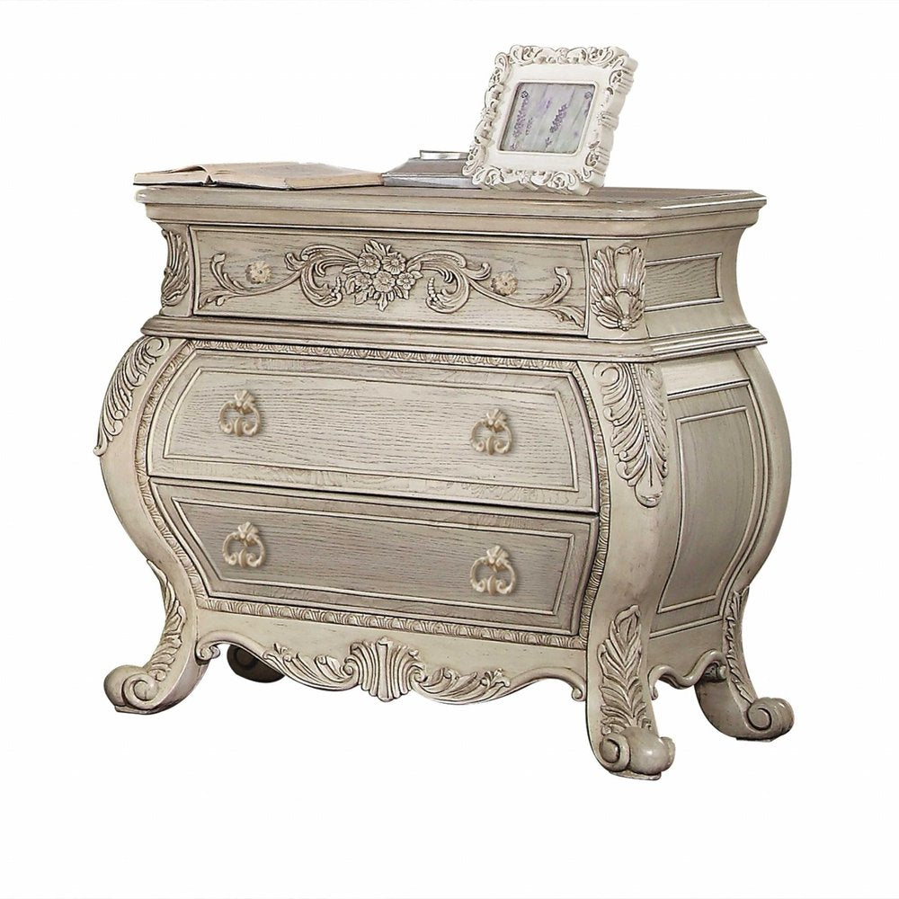 34" Antiqued White Solid Wood Three Drawer Nightstand. Nightstands & bedside table isolated on a plain white background, finished in white wood.