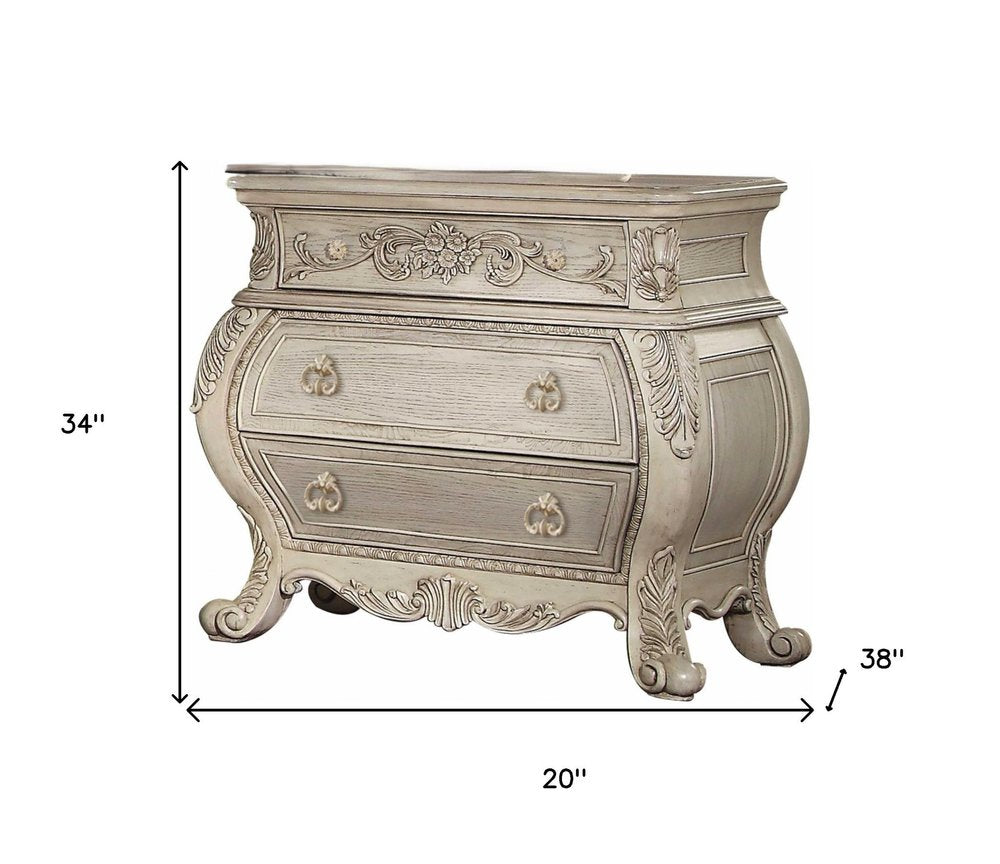 34" Antiqued White Solid Wood Three Drawer Nightstand. Nightstands & bedside table isolated on a plain white background, in a white wood finish.