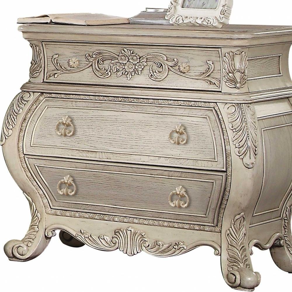 34" Antiqued White Solid Wood Three Drawer Nightstand. Nightstands & bedside table isolated on a plain white background, showing a white wood surface.