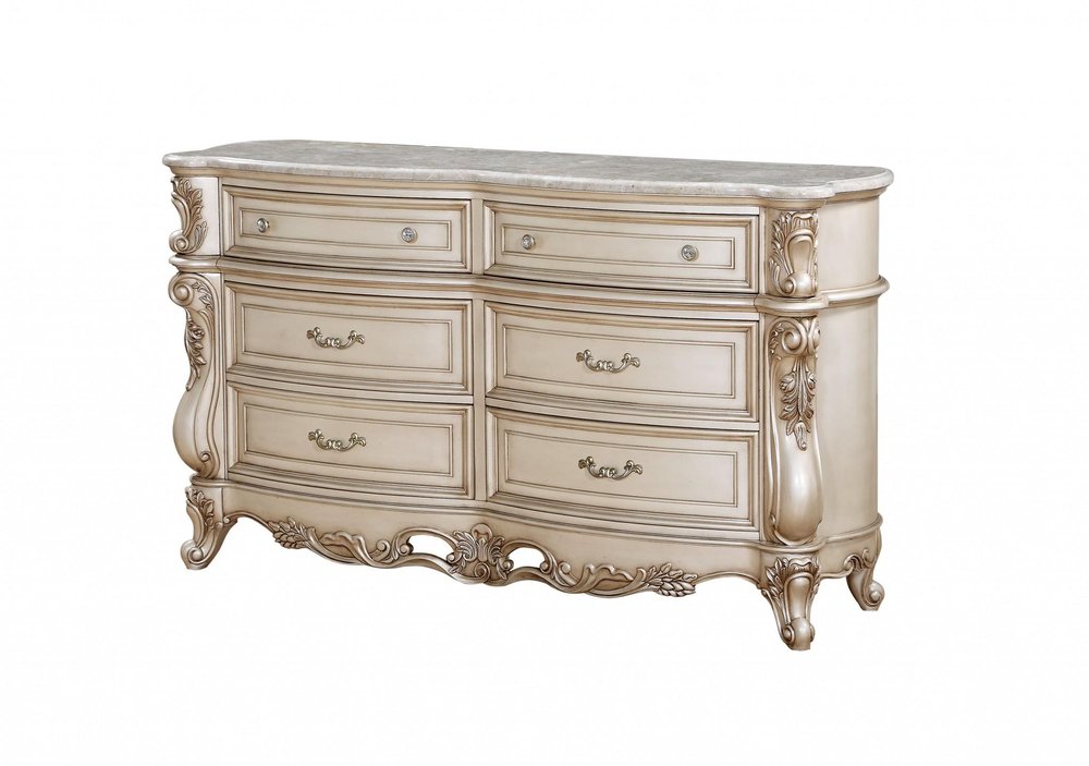 Beige solid wood six-drawer double dresser with a marble top and ornate carved details on a white background.