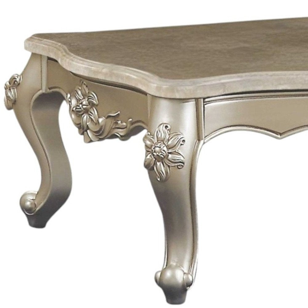 57" Beige Genuine Marble And Solid Wood Coffee Table. Coffee table isolated on a plain white background, showing a beige wood surface.