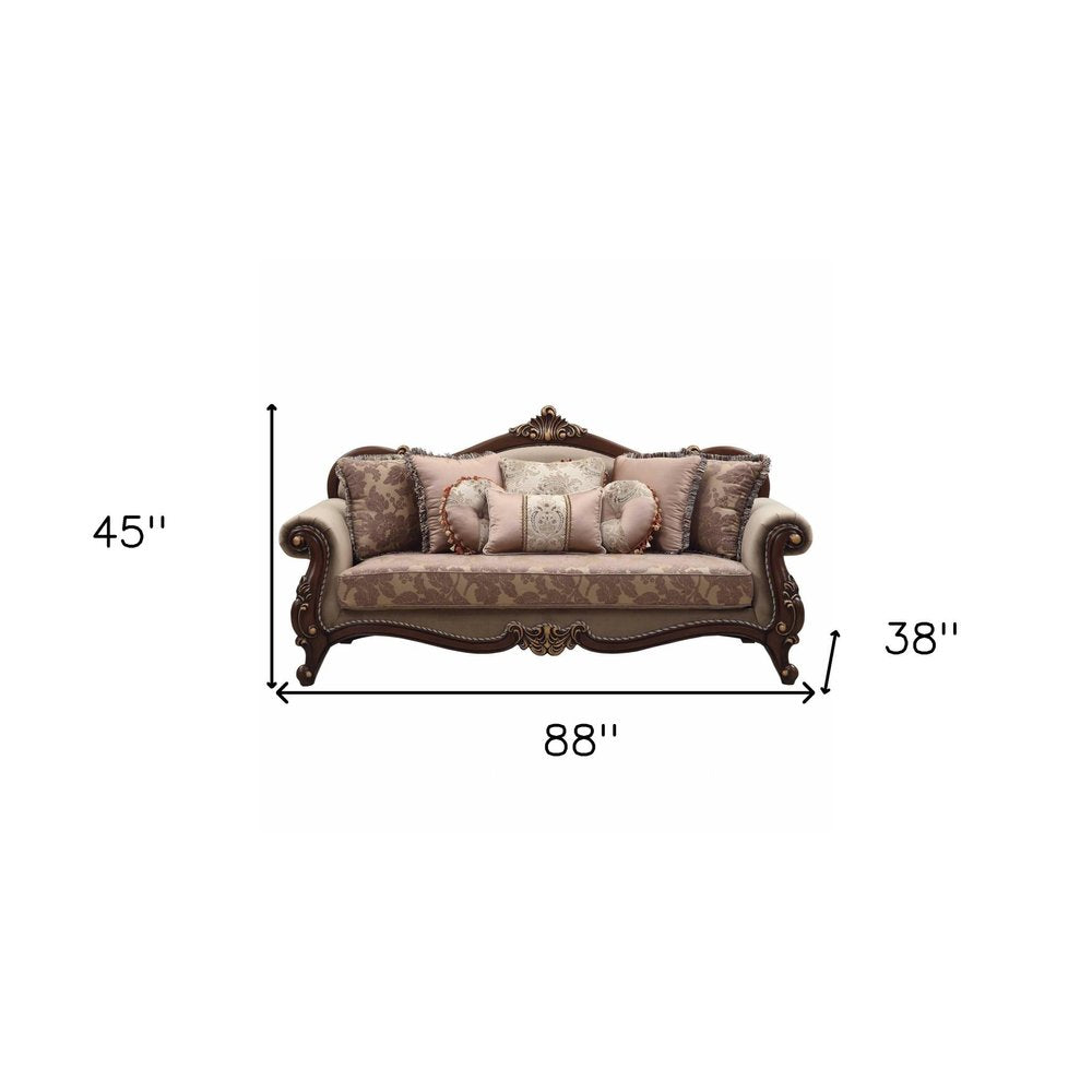 88" Beige Velvet Floral Sofa And Toss Pillows With Brown Legs on a white background