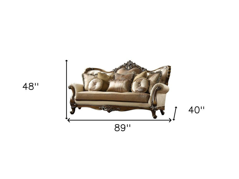 89" Tan Polyester Blend Curved Floral Sofa And Toss Pillows With Brown Legs on a white background