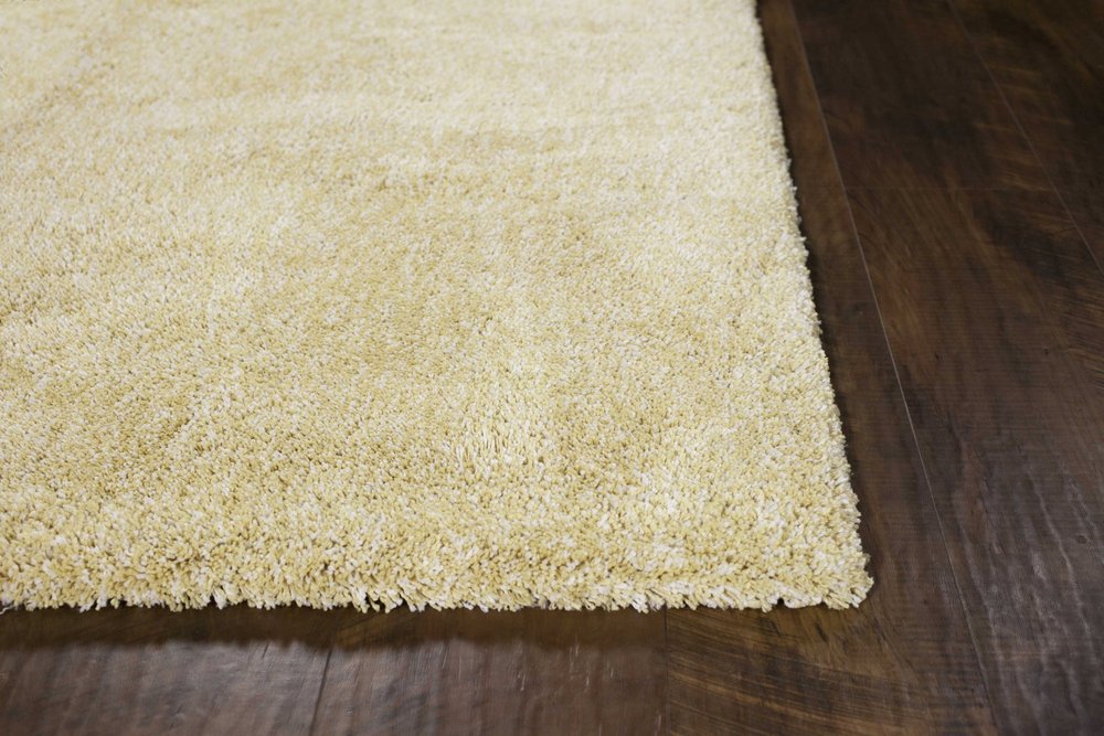 9' X 13' Yellow Shag Hand Woven Area Rug in a home interior