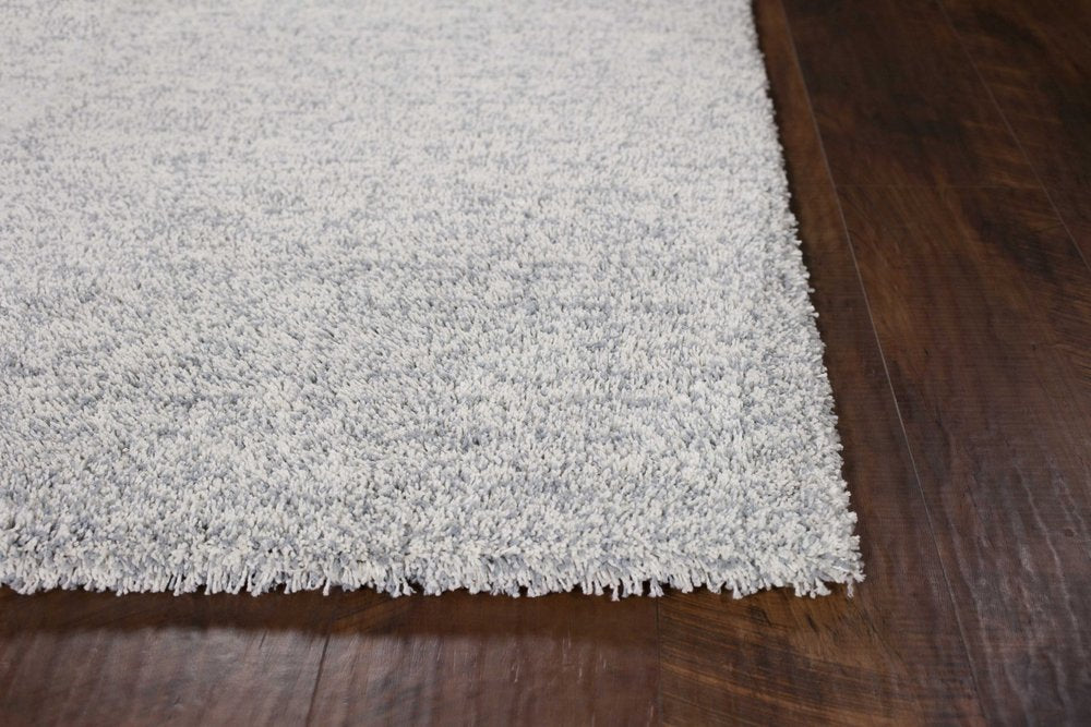 9' X 13' Slate Blue And Ivory Abstract Hand Woven Area Rug in a home interior