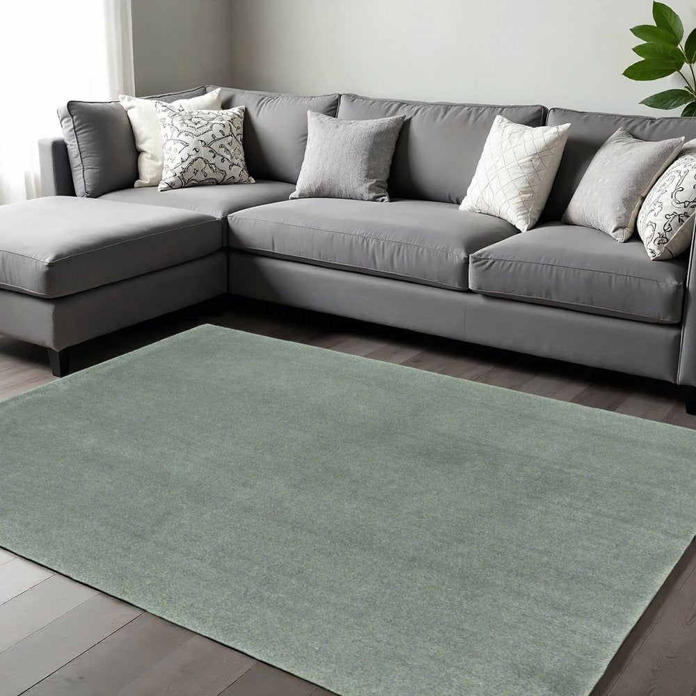 9' X 13' Slate Blue Hand Woven Area Rug in a home interior