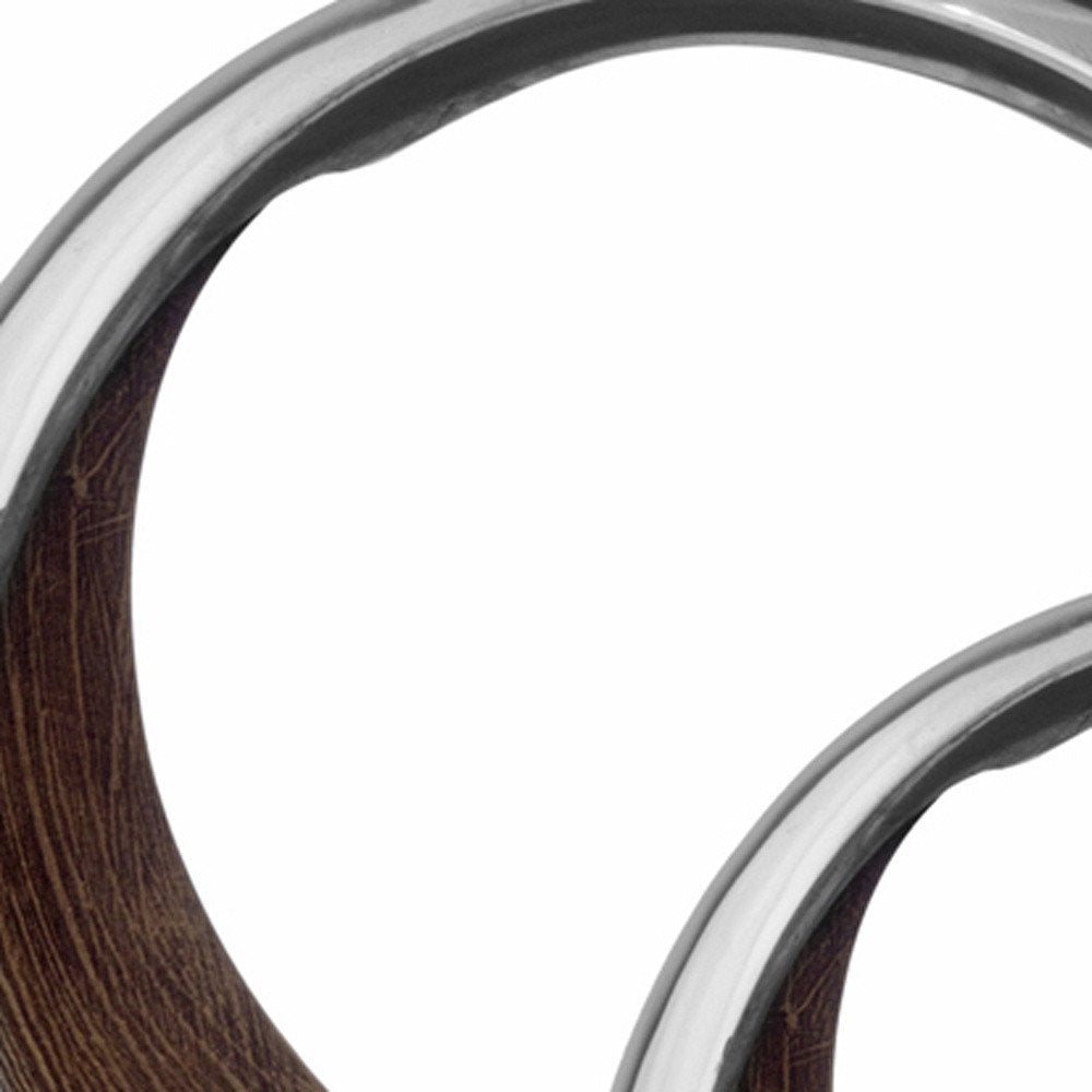 16" Silver and Brown Buffed Aluminum Tabletop Sculpture. Sculpture in silver metal.