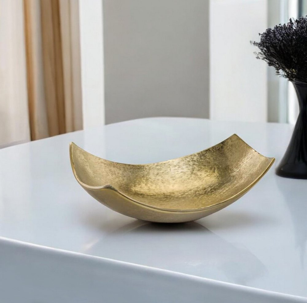 13" Gold Aluminum Modern Scoop Centerpiece Bowl. Kitchen accessory isolated on a plain white background, showing a metal surface.