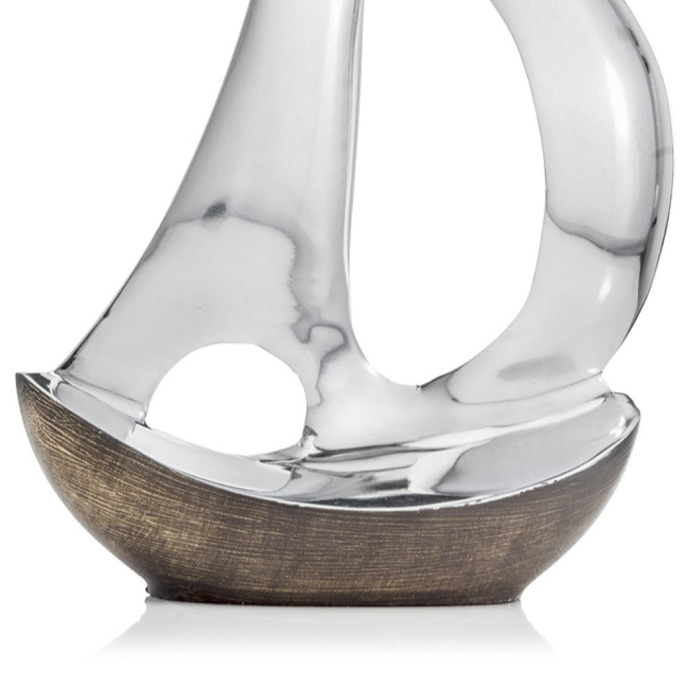 12" Brown and Silver Buffed Aluminum Sailboat Tabletop Sculpture. Sculpture isolated on a plain white background, in a silver metal finish.