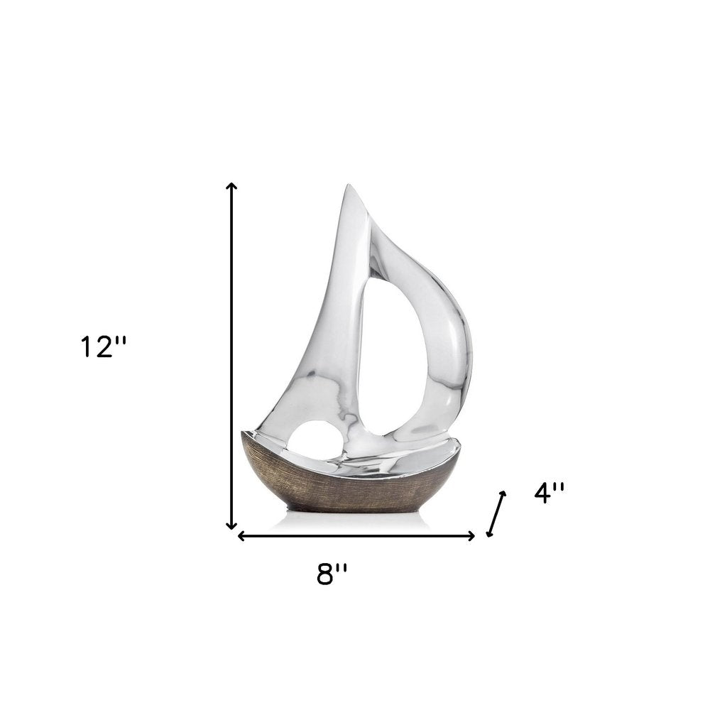 12" Brown and Silver Buffed Aluminum Sailboat Tabletop Sculpture. Sculpture isolated on a plain white background, finished in silver metal.